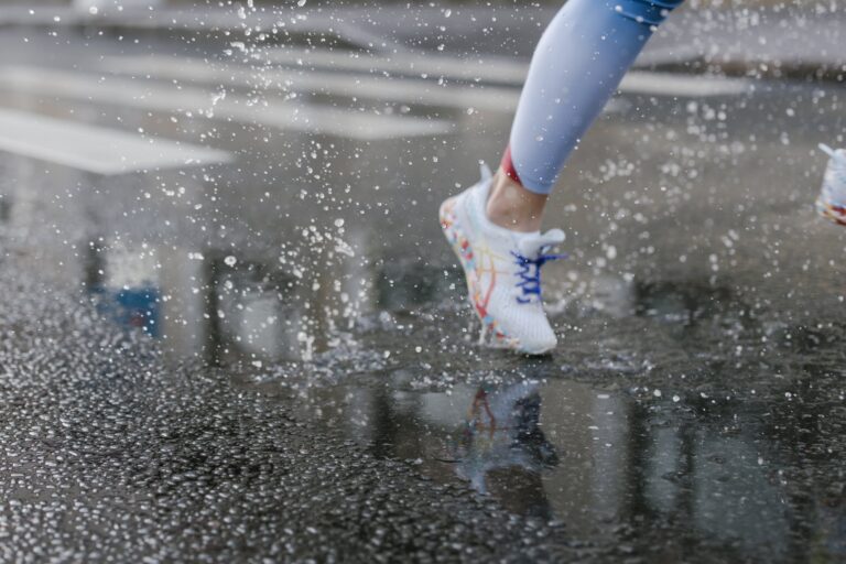 a person running on wet road